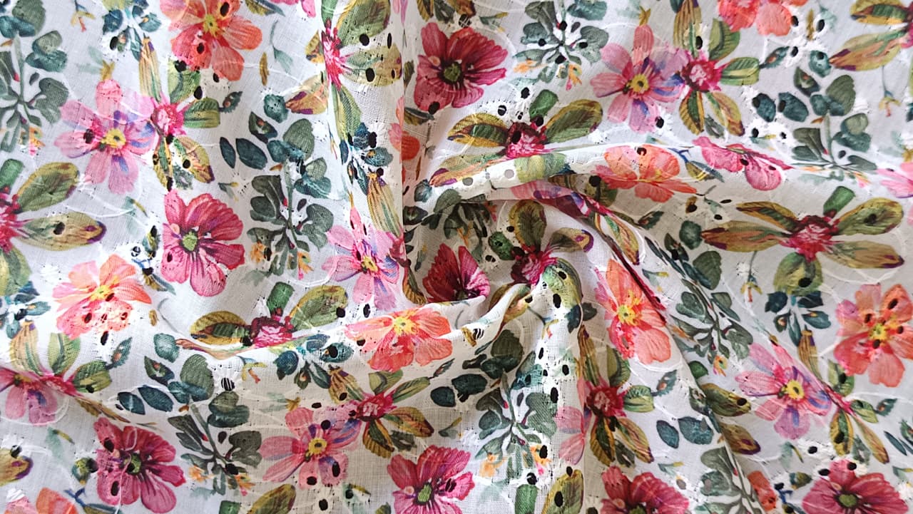 Close-up of soft, wrinkled pink cotton fabric displaying fine weave texture.