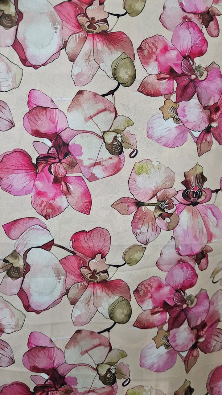 Close-up of soft, wrinkled pink cotton fabric displaying fine weave texture.