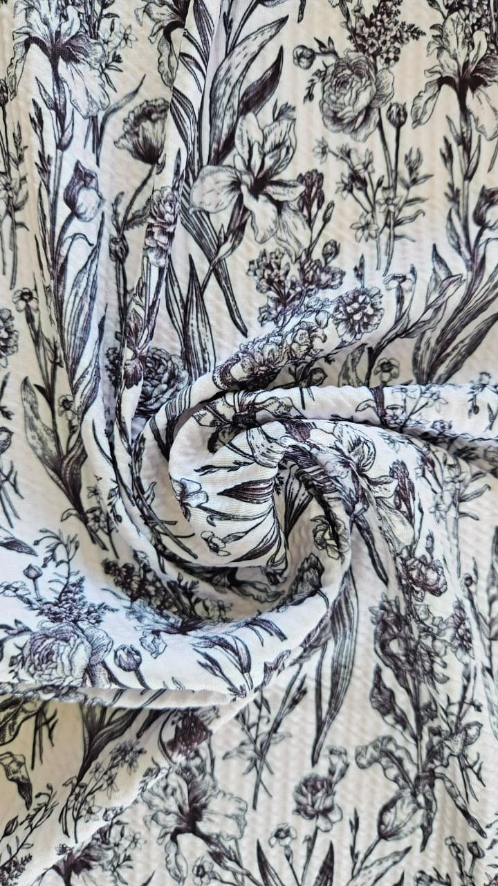 Close-up of soft, wrinkled pink cotton fabric displaying fine weave texture.