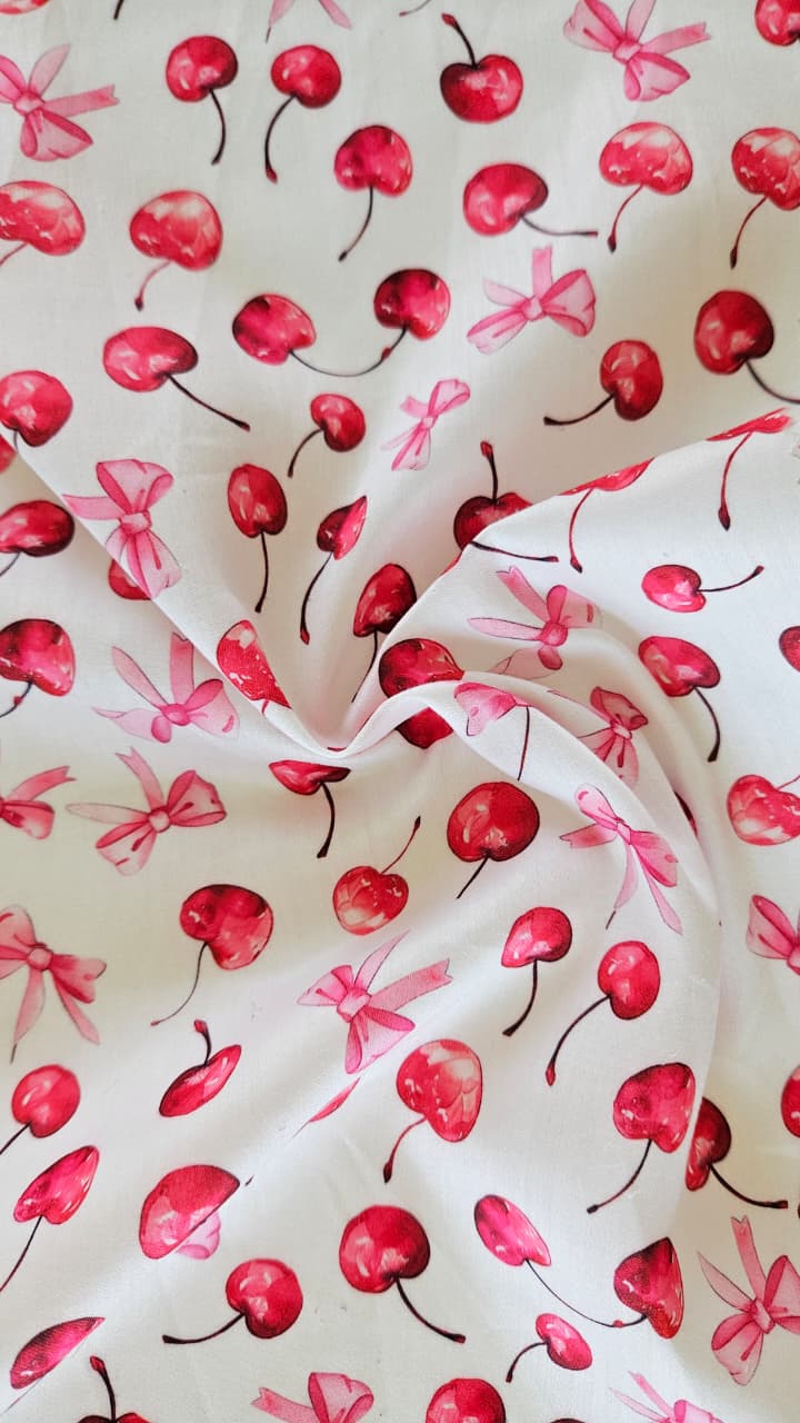 Close-up of soft, wrinkled pink cotton fabric displaying fine weave texture.