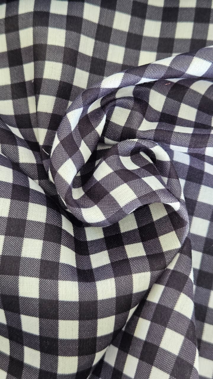 Close-up of soft, wrinkled pink cotton fabric displaying fine weave texture.