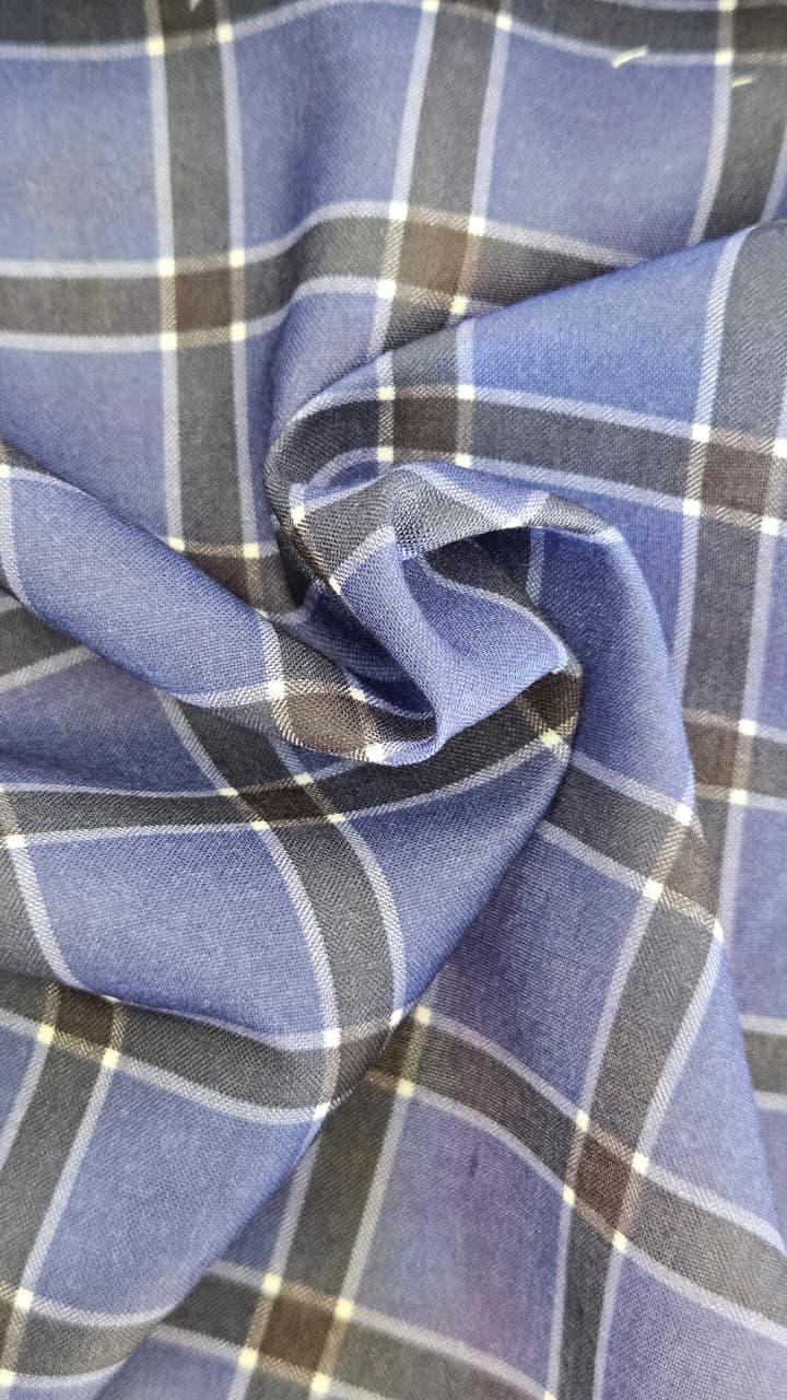 Close-up of soft, wrinkled pink cotton fabric displaying fine weave texture.