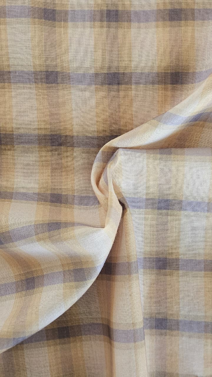Close-up of soft, wrinkled pink cotton fabric displaying fine weave texture.