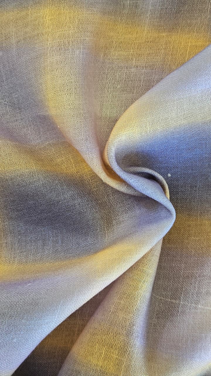 Close-up of soft, wrinkled pink cotton fabric displaying fine weave texture.