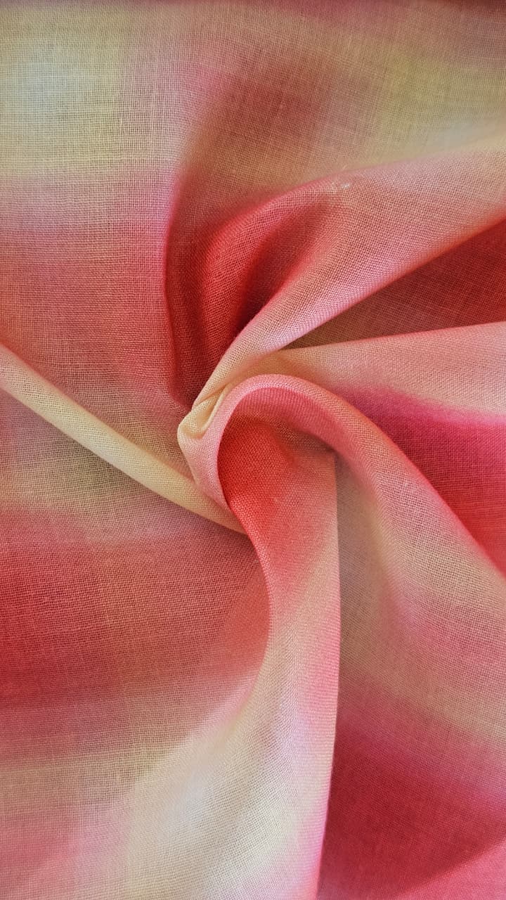 Close-up of soft, wrinkled pink cotton fabric displaying fine weave texture.