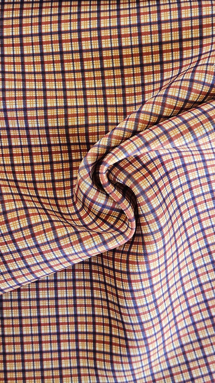 Close-up of soft, wrinkled pink cotton fabric displaying fine weave texture.