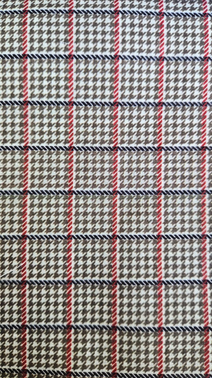 Close-up of soft, wrinkled pink cotton fabric displaying fine weave texture.