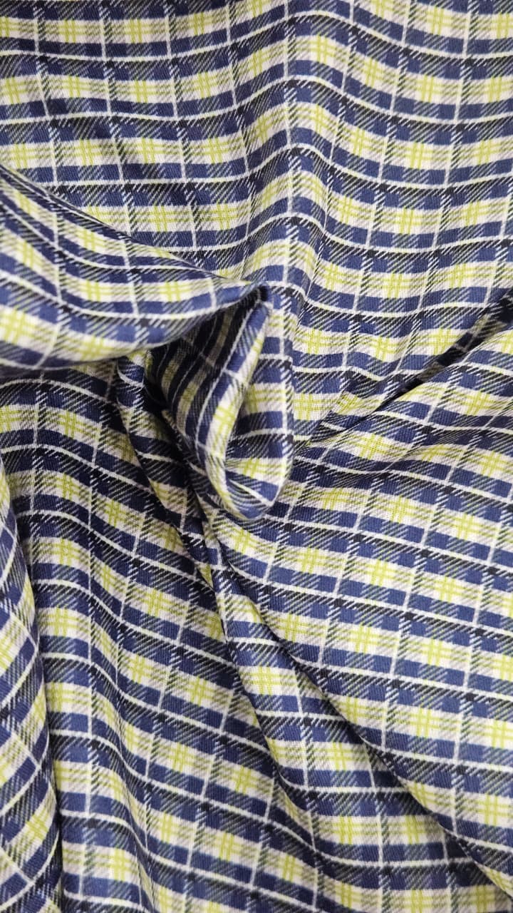 Close-up of soft, wrinkled pink cotton fabric displaying fine weave texture.