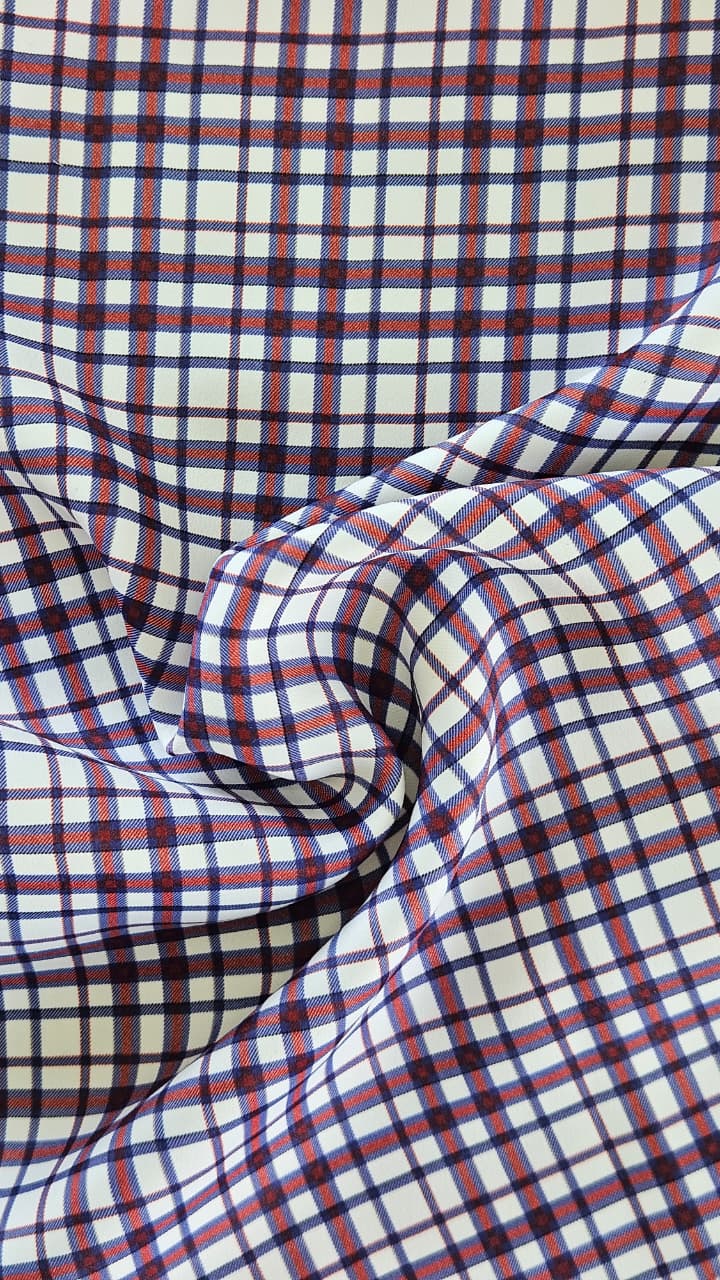 Close-up of soft, wrinkled pink cotton fabric displaying fine weave texture.