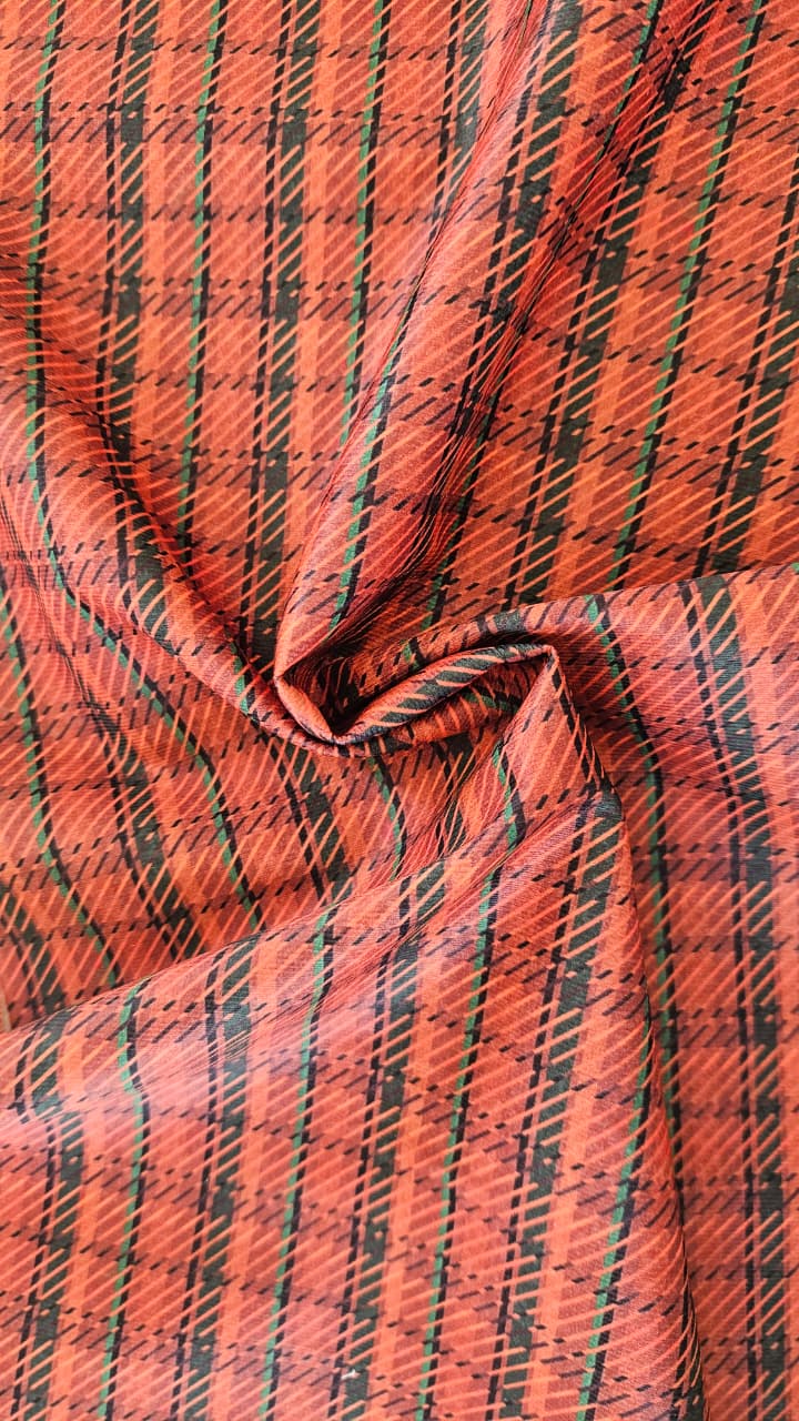 Close-up of soft, wrinkled pink cotton fabric displaying fine weave texture.