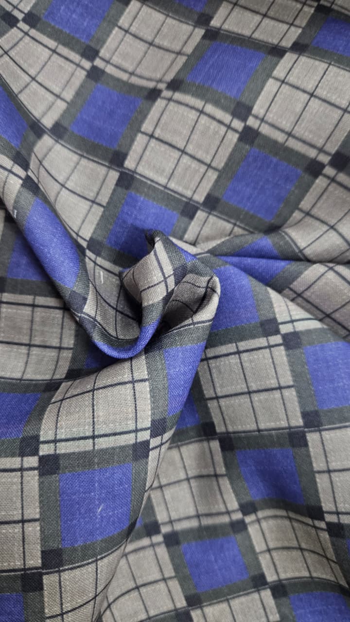 Close-up of soft, wrinkled pink cotton fabric displaying fine weave texture.