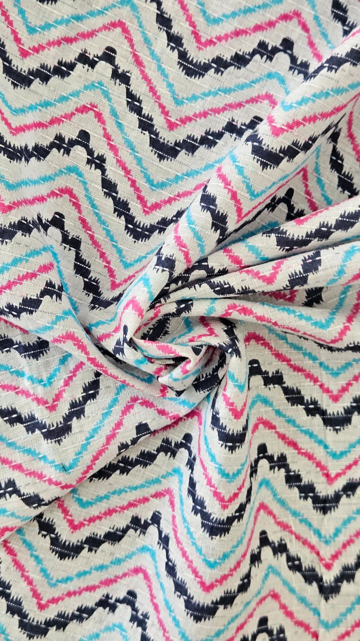 Close-up of soft, wrinkled pink cotton fabric displaying fine weave texture.