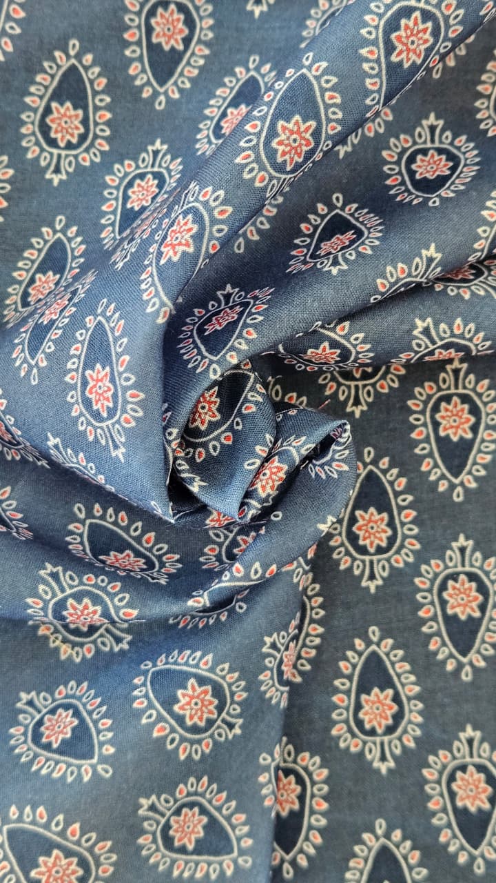 Close-up of soft, wrinkled pink cotton fabric displaying fine weave texture.