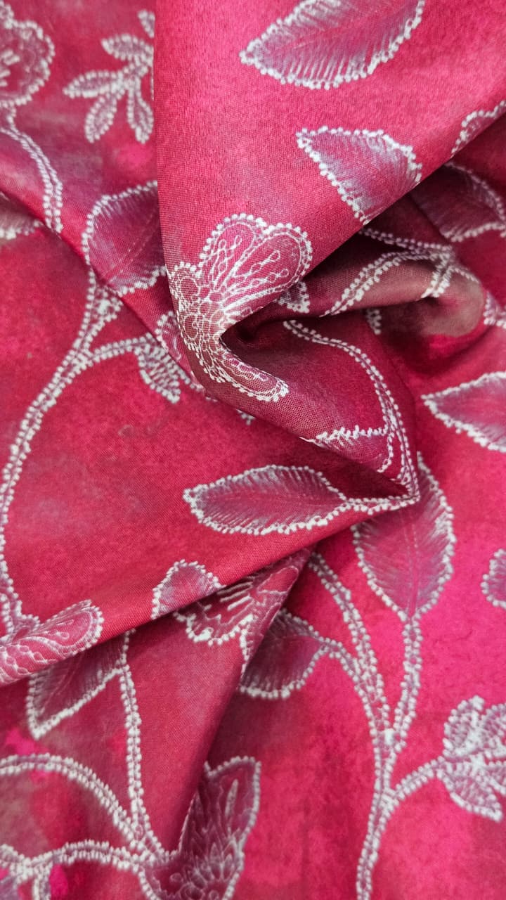 Close-up of soft, wrinkled pink cotton fabric displaying fine weave texture.