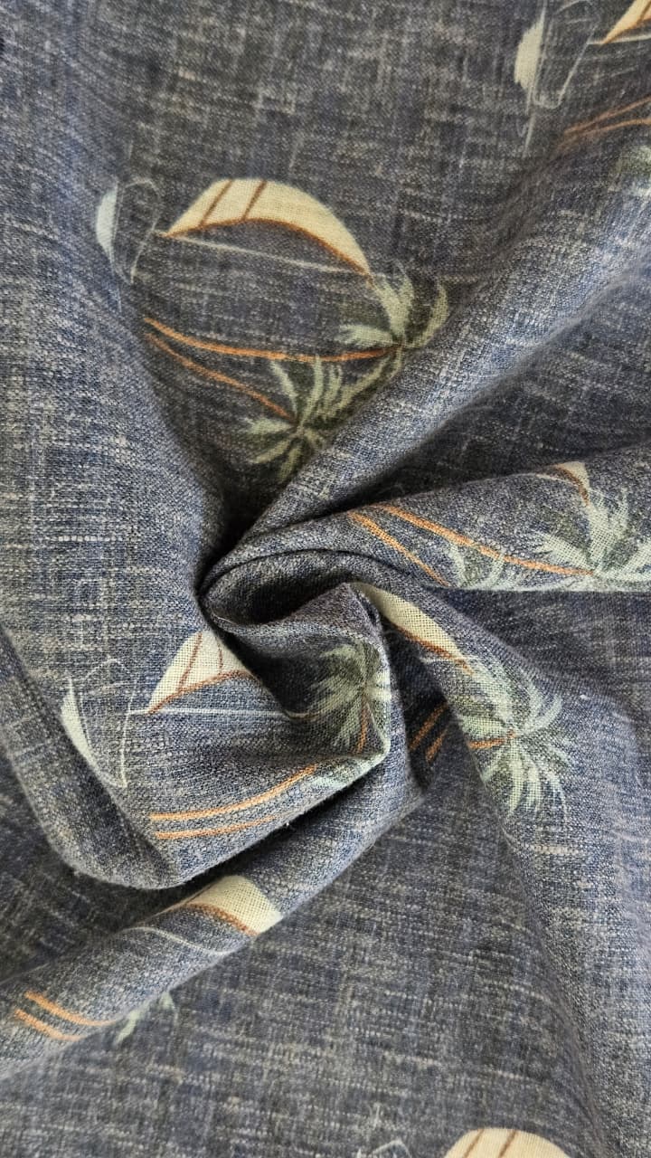 Close-up of soft, wrinkled pink cotton fabric displaying fine weave texture.