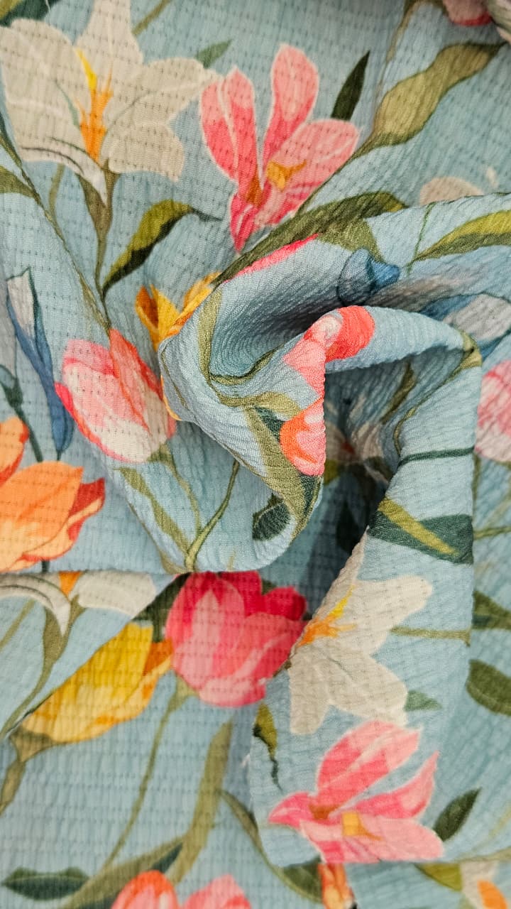 Close-up of soft, wrinkled pink cotton fabric displaying fine weave texture.