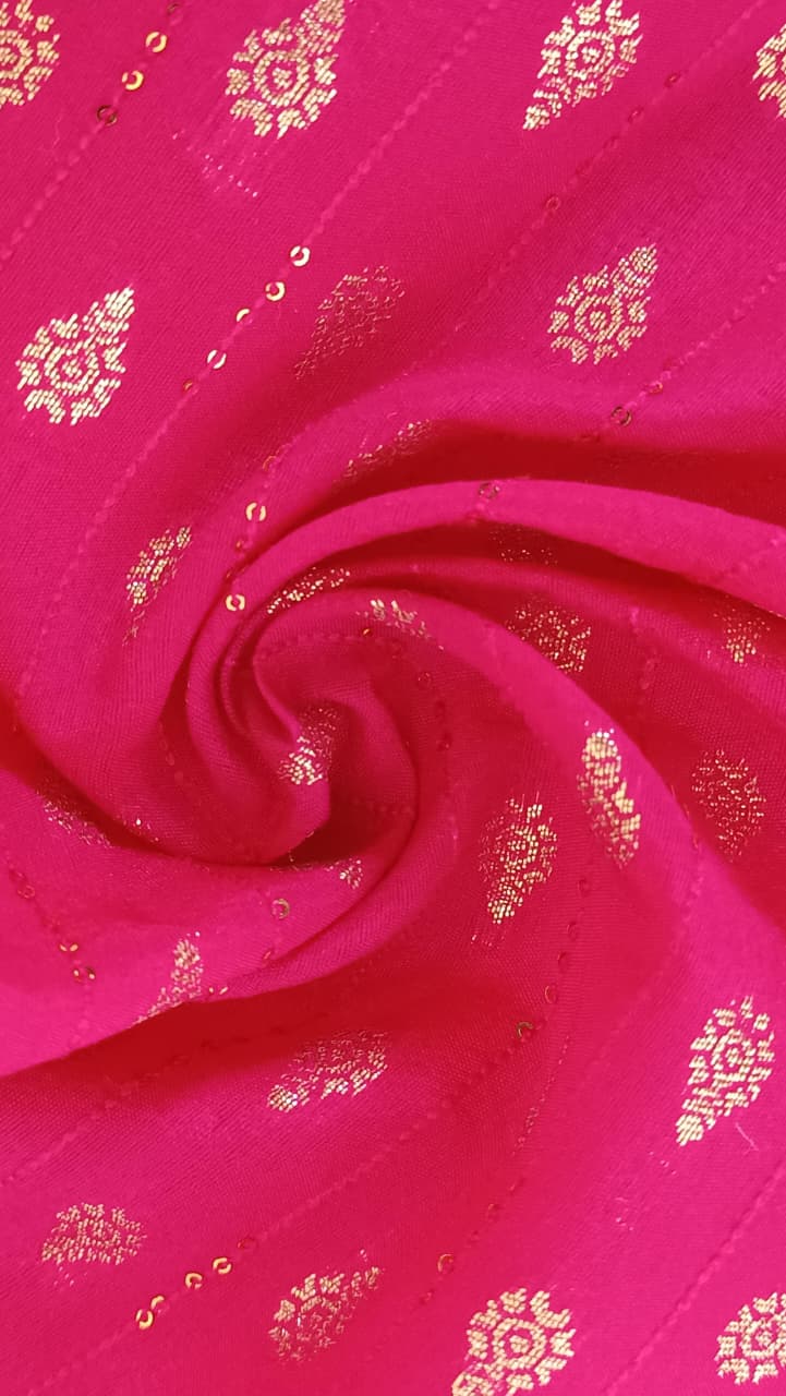Close-up of soft, wrinkled pink cotton fabric displaying fine weave texture.
