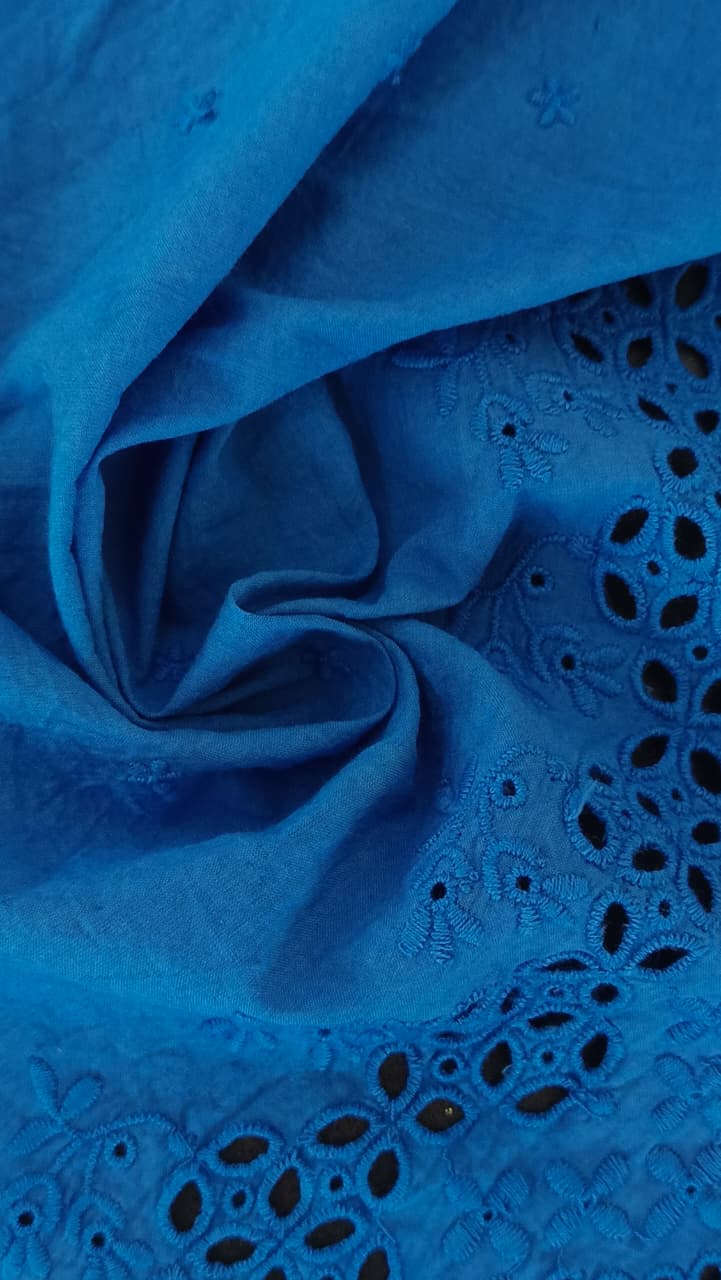 Close-up of soft, wrinkled pink cotton fabric displaying fine weave texture.