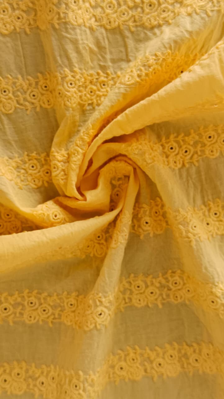 Close-up of soft, wrinkled pink cotton fabric displaying fine weave texture.