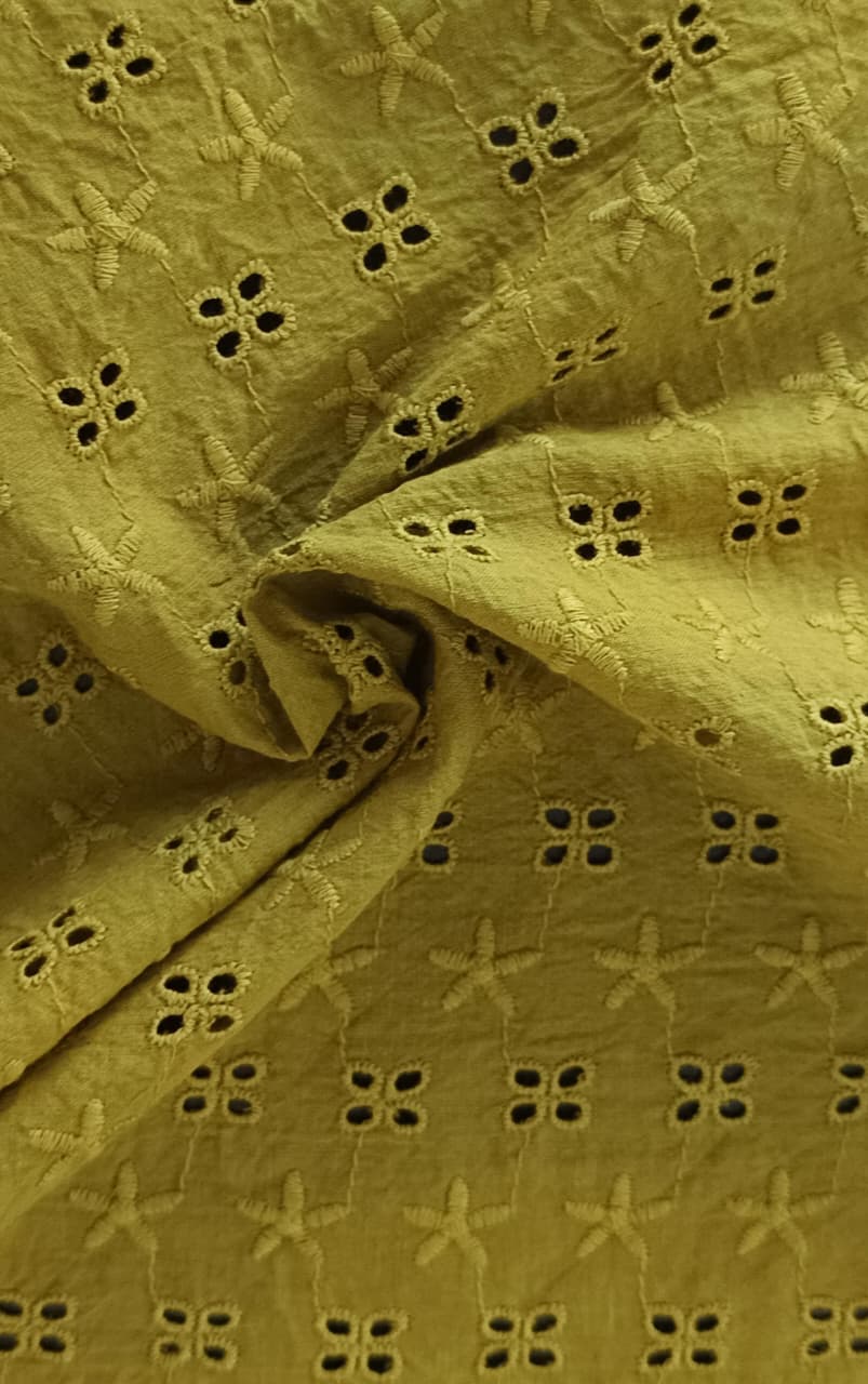 Close-up of soft, wrinkled pink cotton fabric displaying fine weave texture.