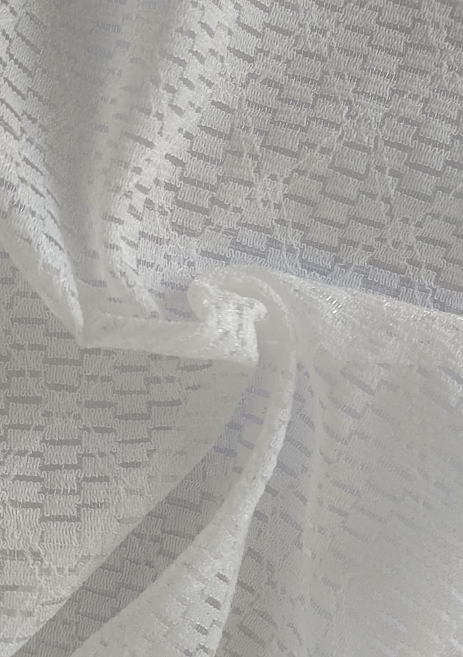 Close-up of soft, wrinkled pink cotton fabric displaying fine weave texture.