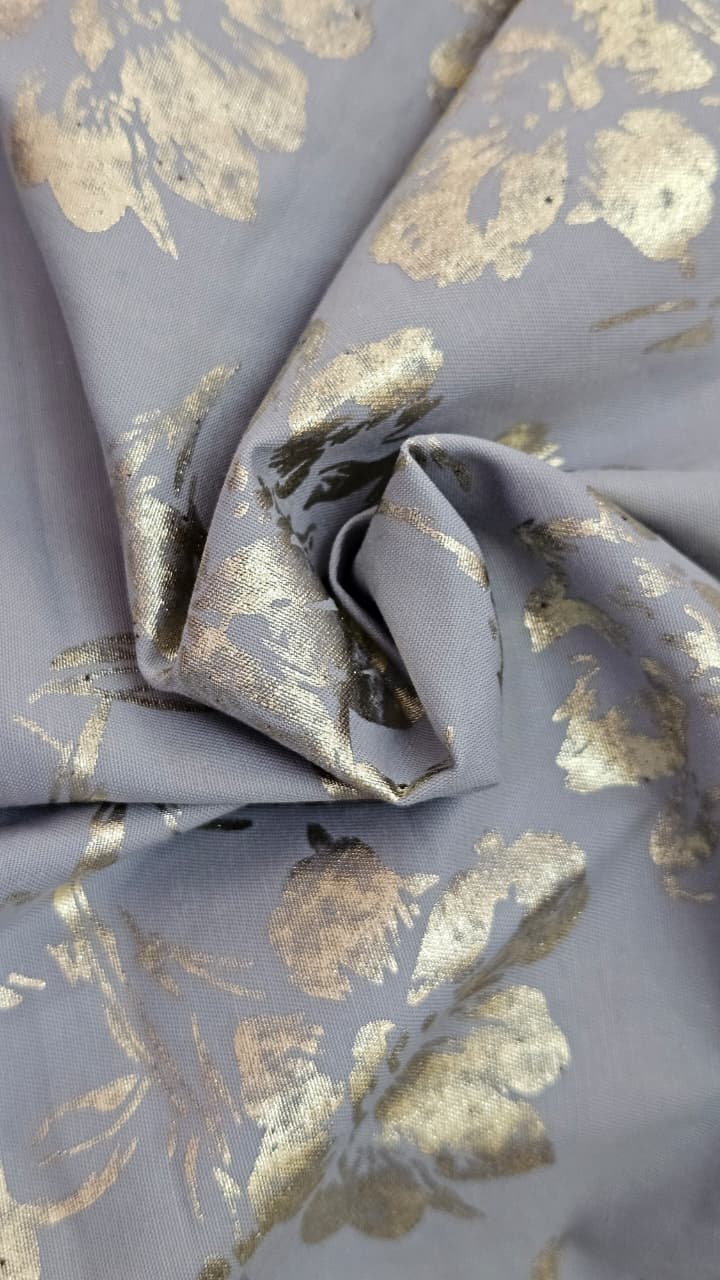 Close-up of soft, wrinkled pink cotton fabric displaying fine weave texture.