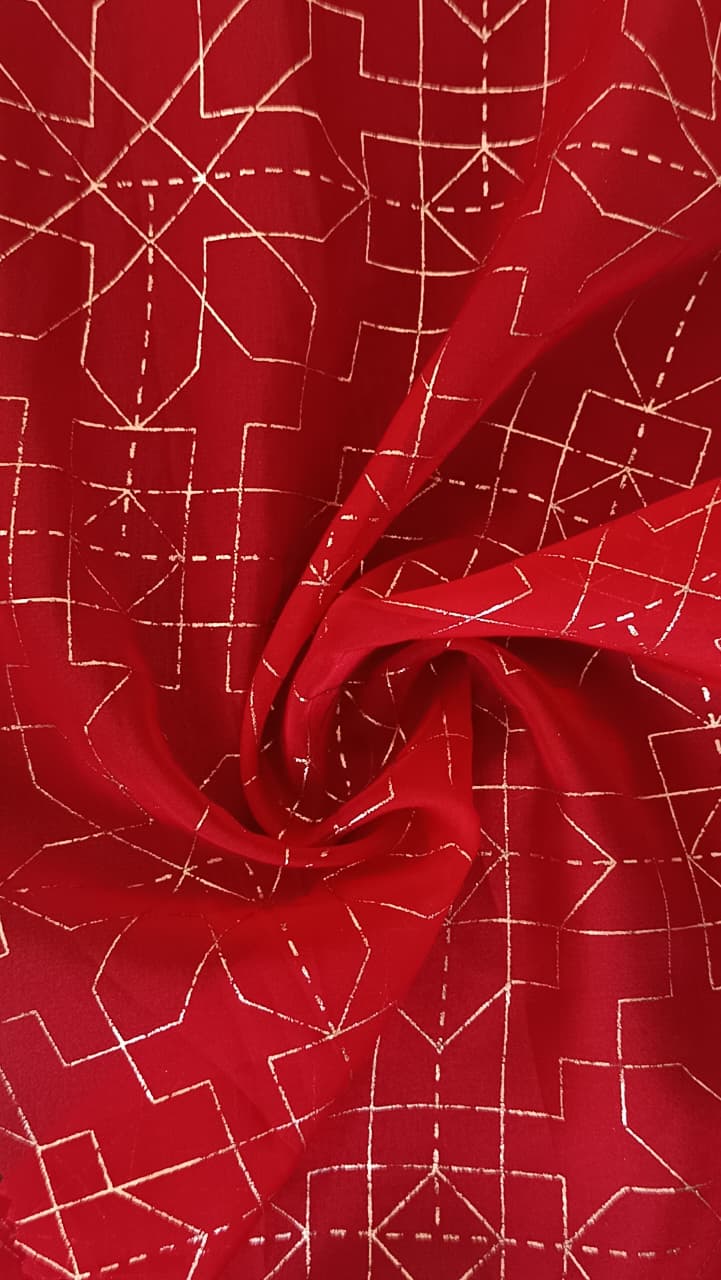 Close-up of soft, wrinkled pink cotton fabric displaying fine weave texture.