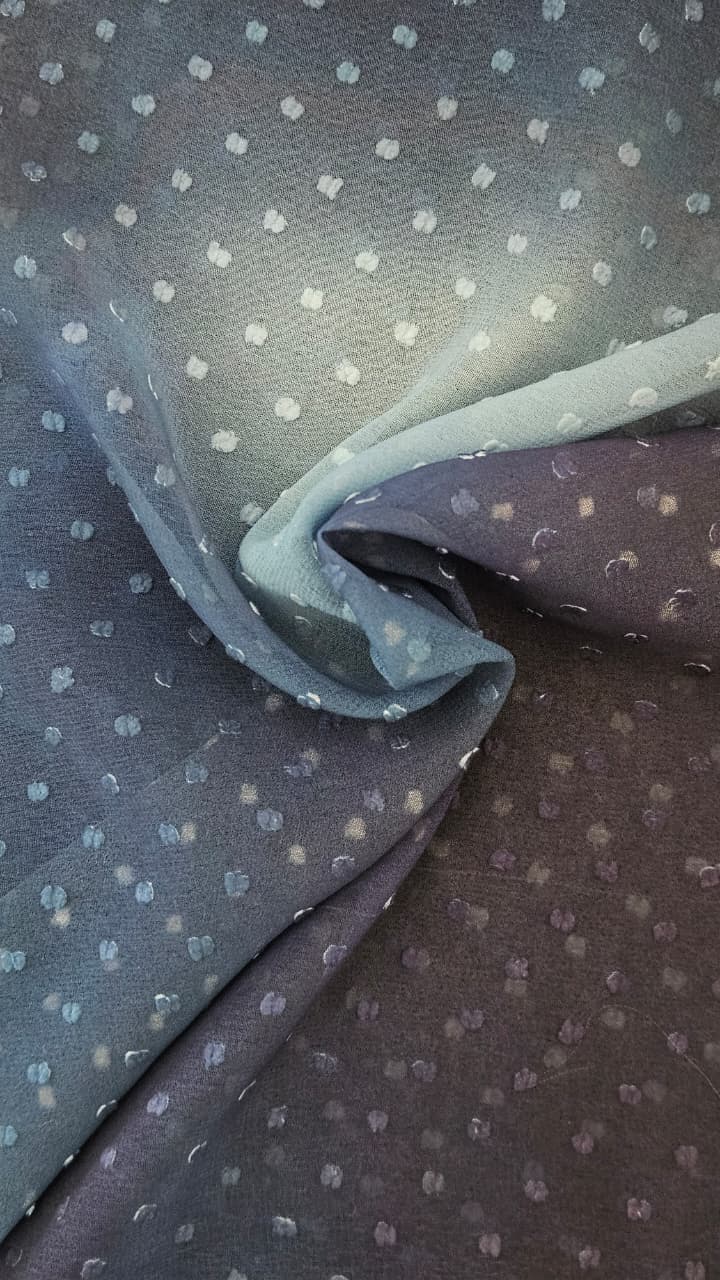 Close-up of soft, wrinkled pink cotton fabric displaying fine weave texture.