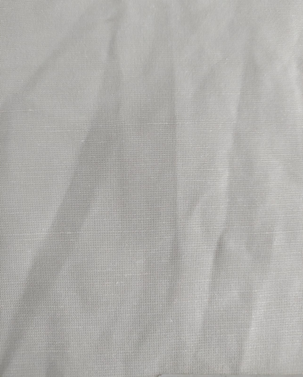 Close-up of soft, wrinkled pink cotton fabric displaying fine weave texture.