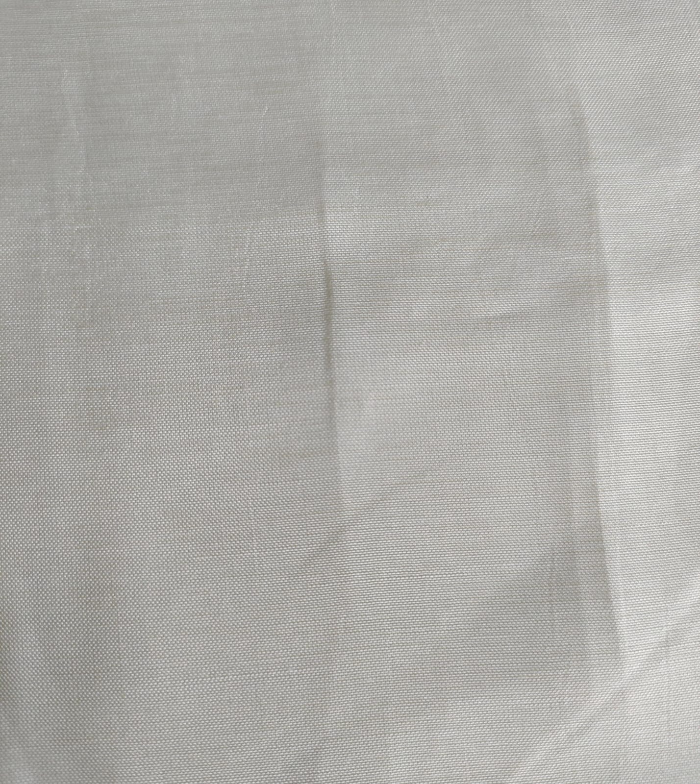 Close-up of soft, wrinkled pink cotton fabric displaying fine weave texture.