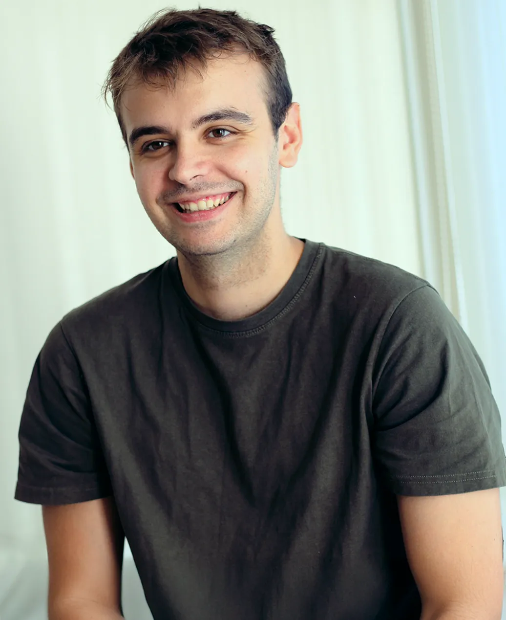 a photo of ivan kirev smiling