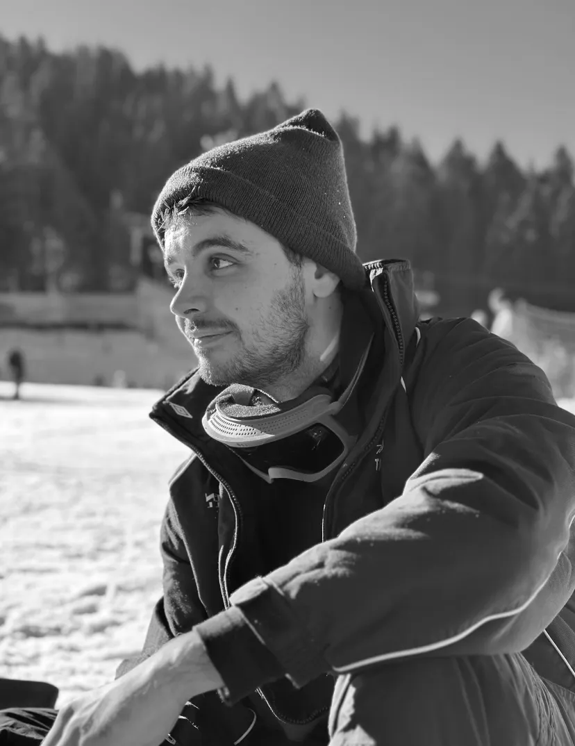 a black and white photo of ivan kirev at the mountains
