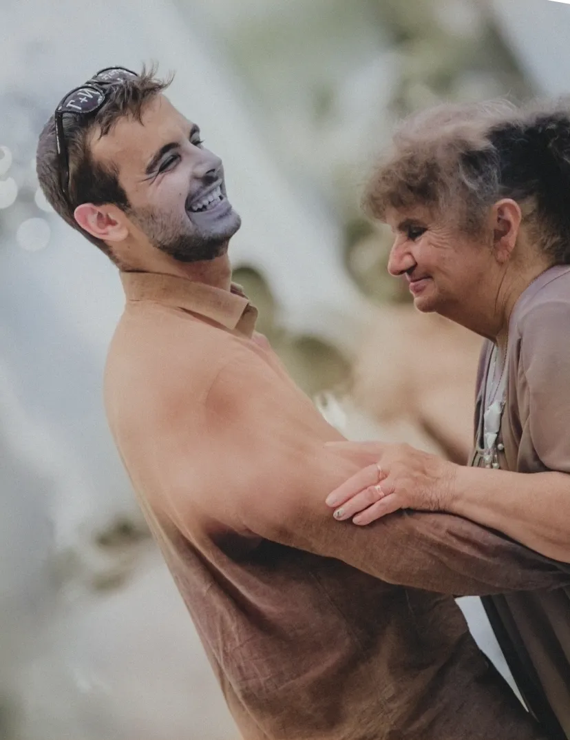 a photo of ivan kirev dancing with his grandmother at his sister's wedding