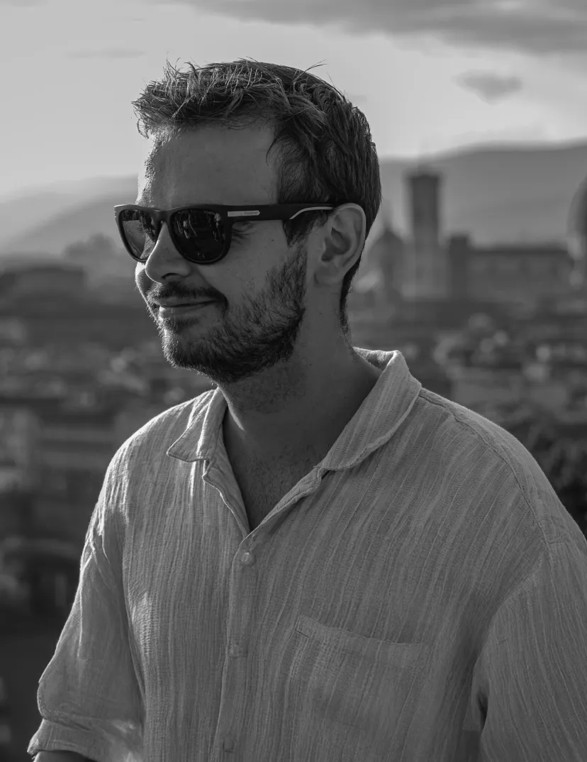 a black and white photo of ivan kirev with glasses