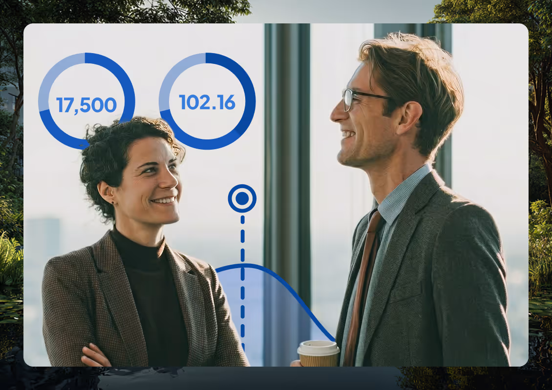 Smiling man in a grey shirt with data charts showing 102.16 and 17,500 in office background.