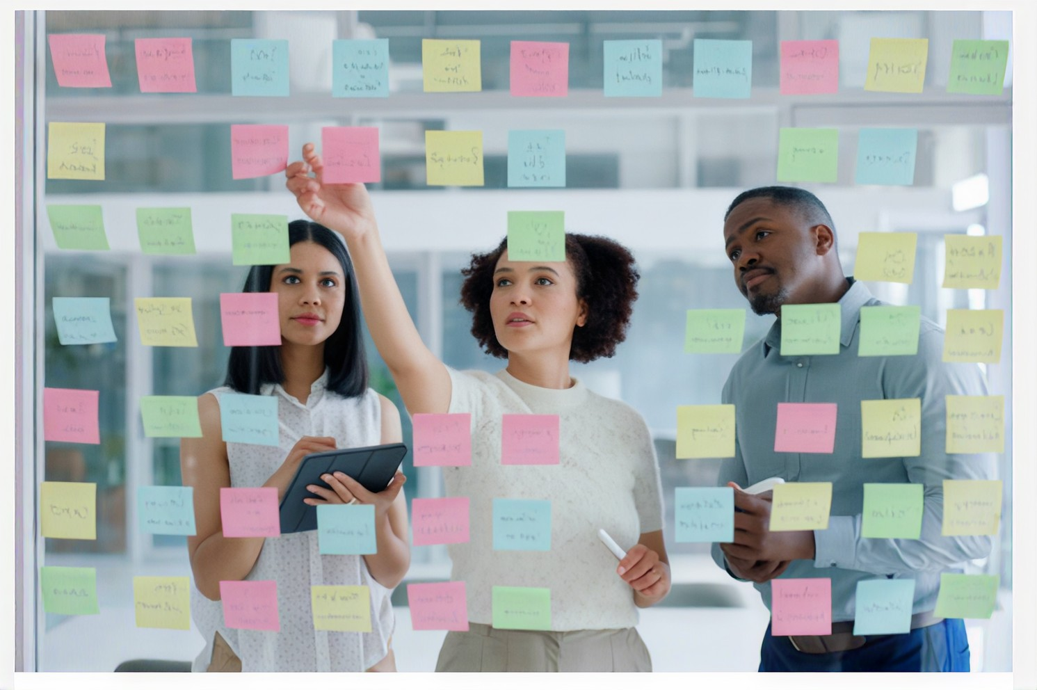 Professionals collaborating, strategizing, and working in modern office environments.