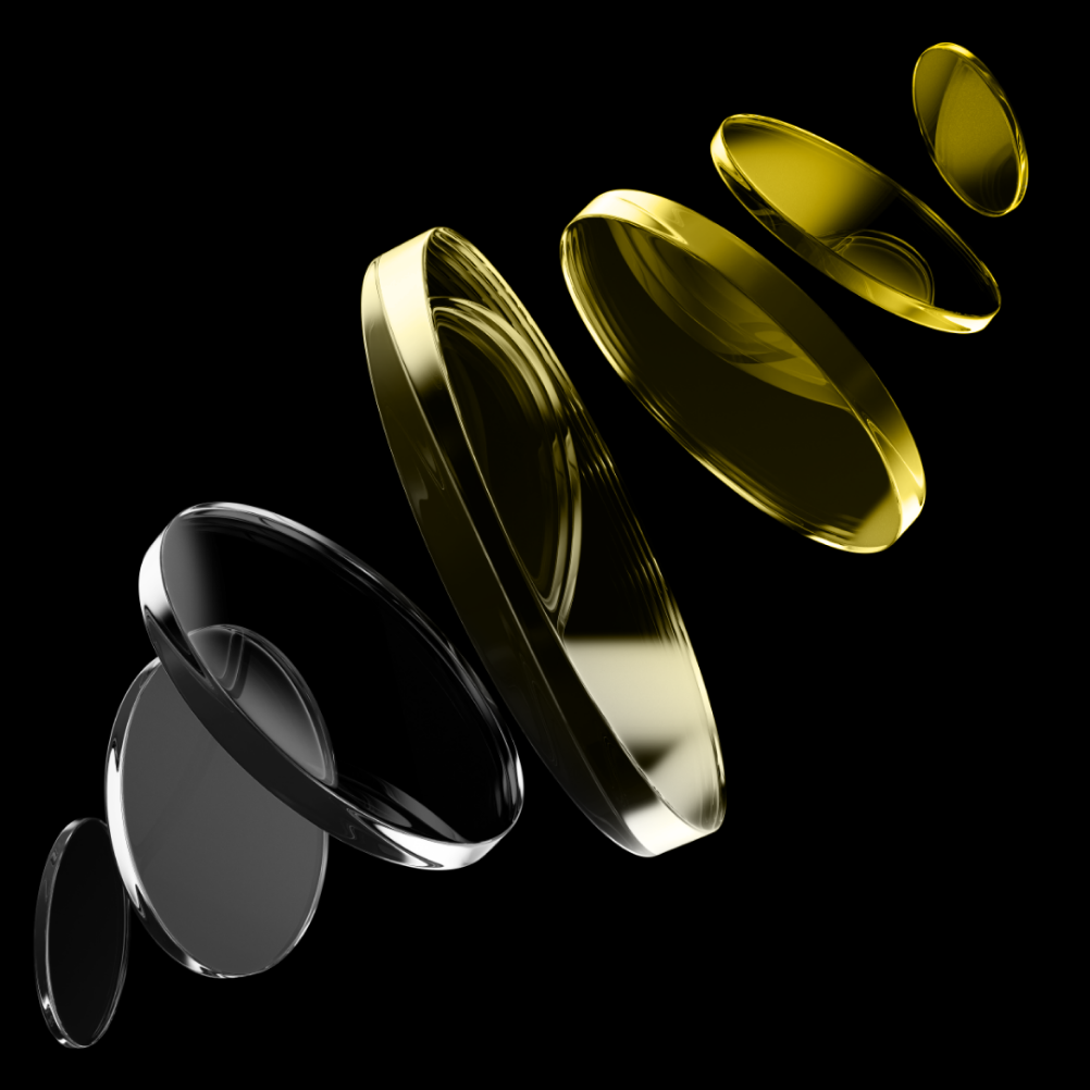 Set of five transparent camera lens elements arranged in two groups floating on black background.