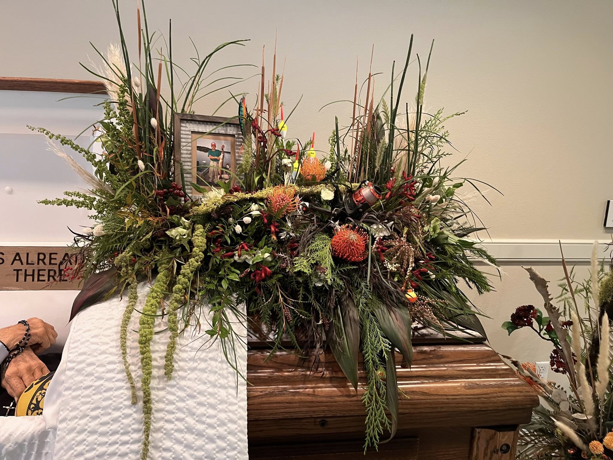 A large seasonal mantel arrangement styled in place by Simply Blooming