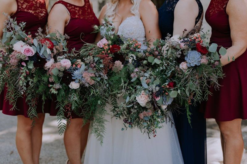Reception table flowers styled by Simply Blooming