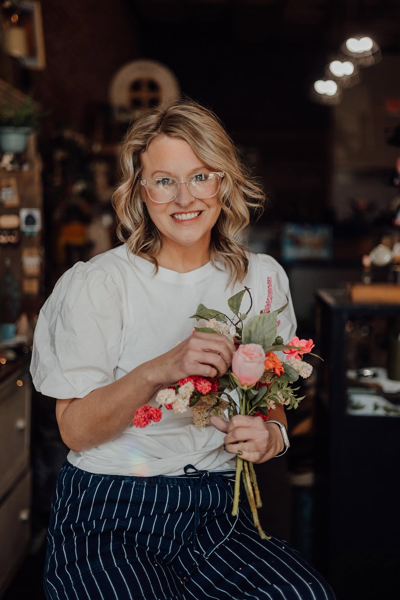 Lisa of Simply Blooming smiling while building a fresh bouquet