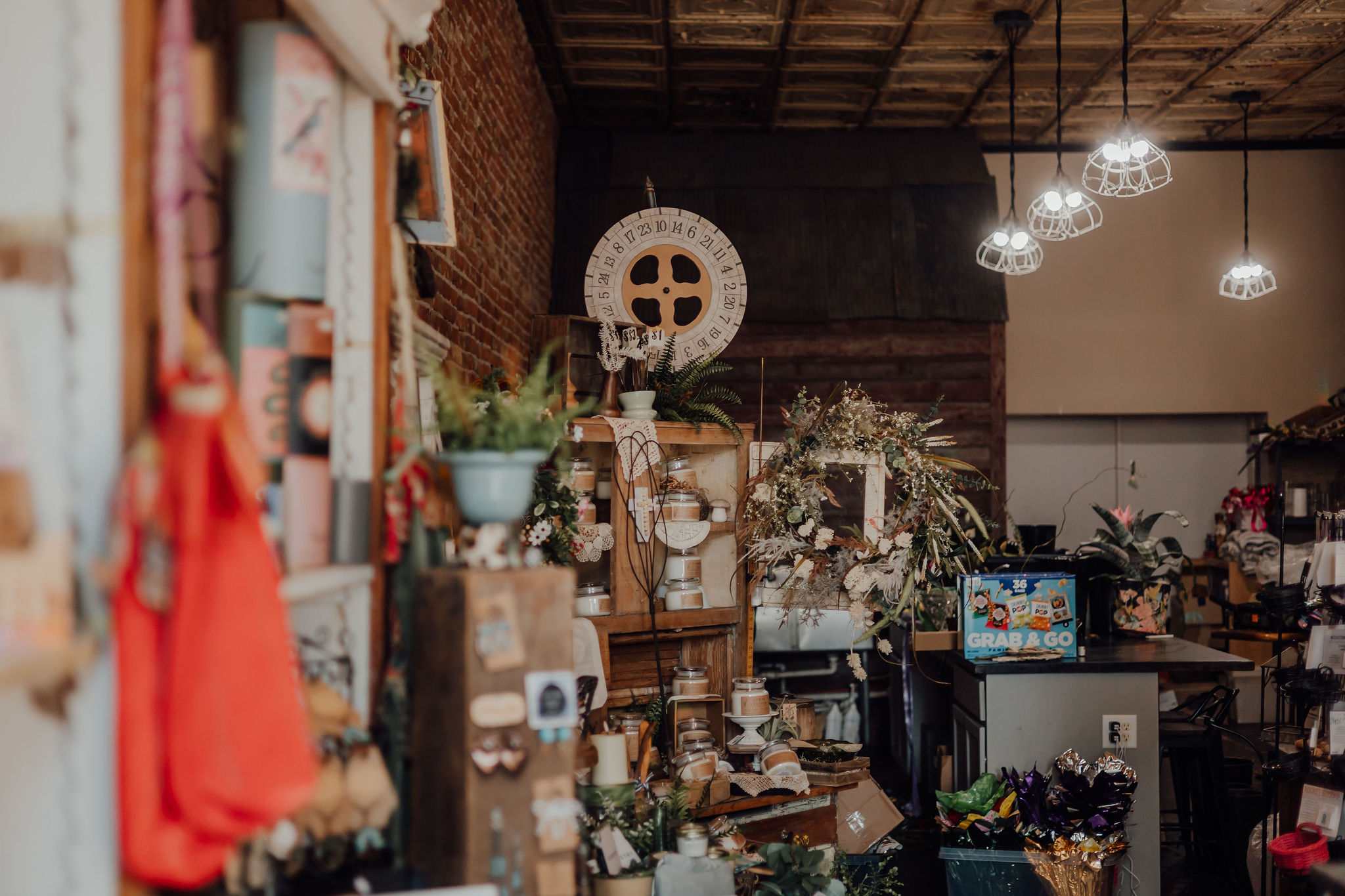 Inside the shop — tin ceiling and cage lights