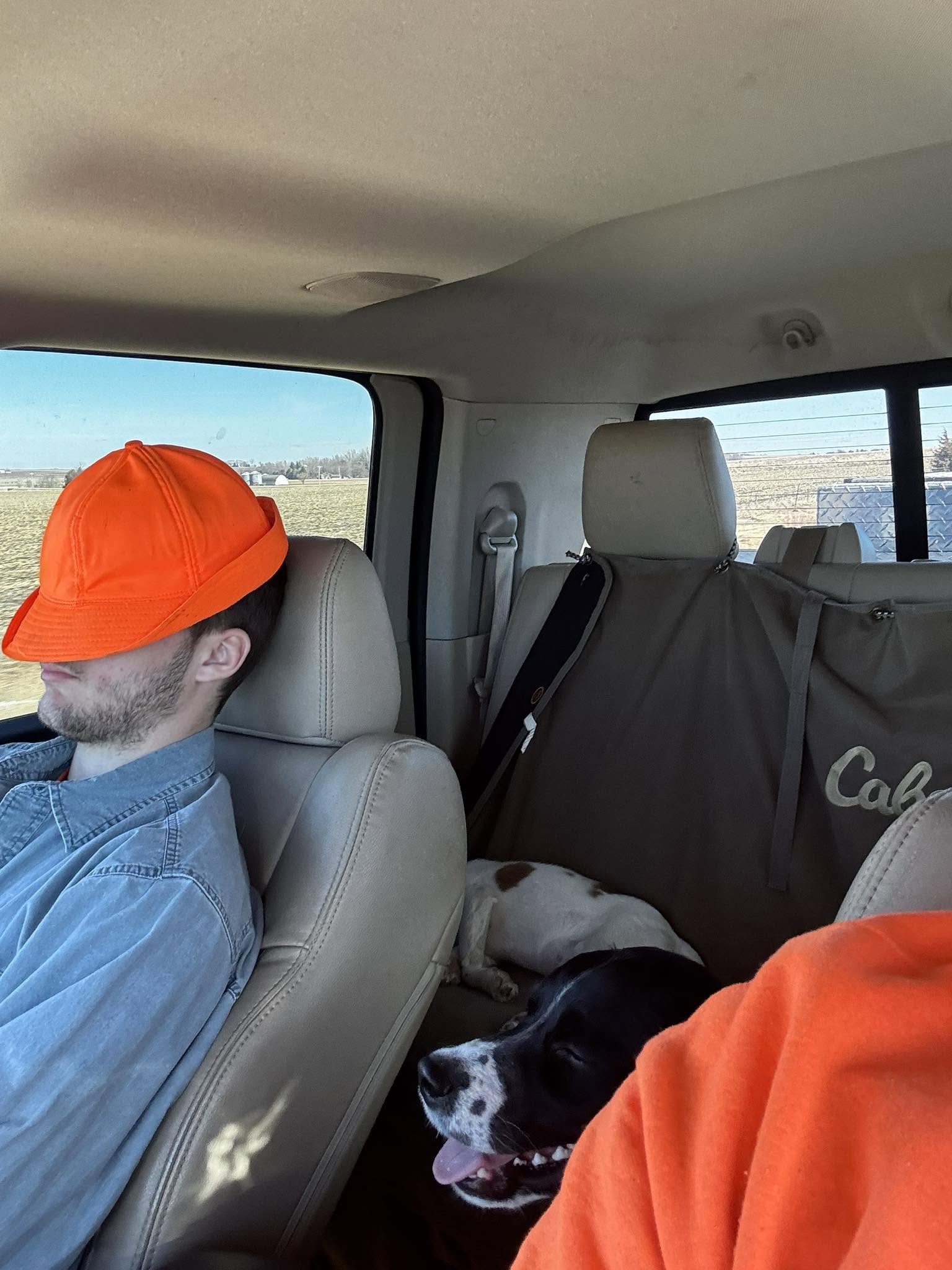 The boys asleep in the truck after a hunt
