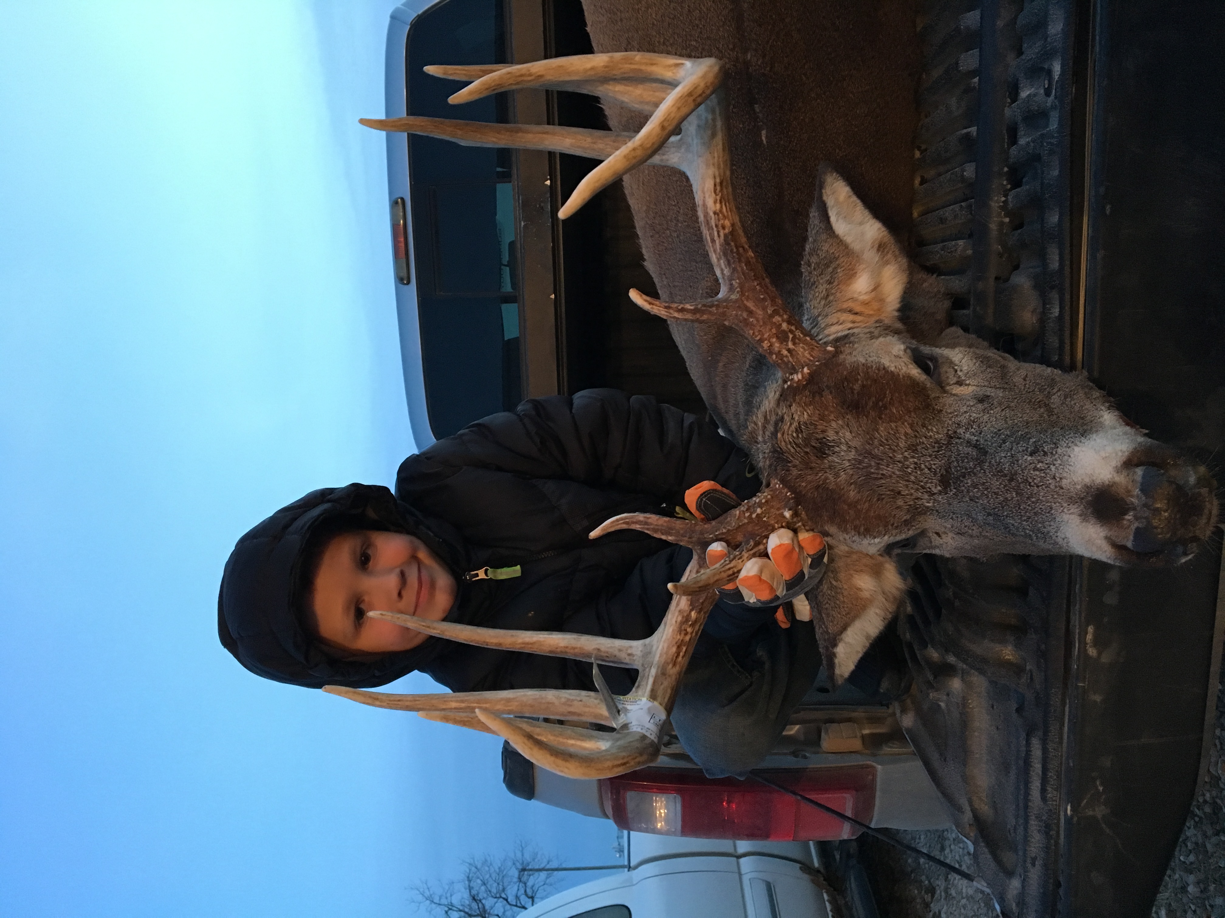 Roman as a little boy with one of Dan's bucks in the truck bed