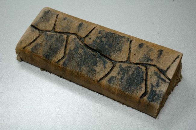 Flagstone slant concrete curbing texture