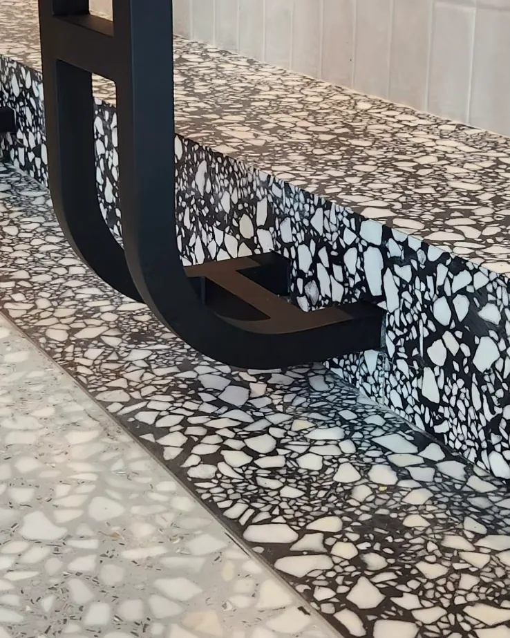 venetian terrazzo surface with mixed marble fragments and polished finish