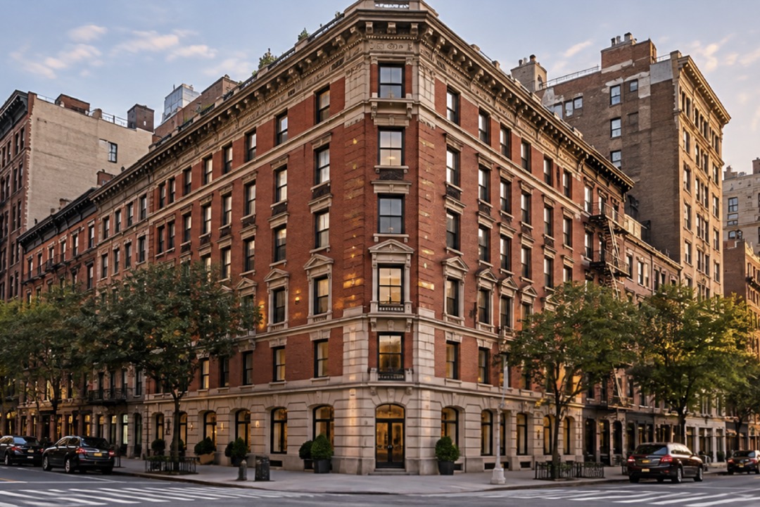 Prewar corner apartment building at dusk