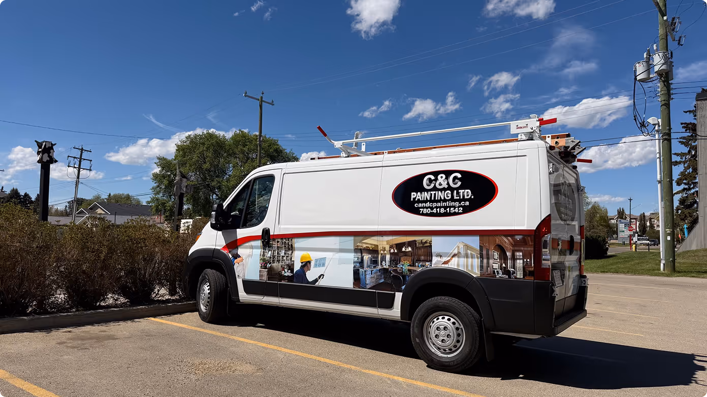 White van with C&C Painting LTD. logo parked in a lot under blue sky with ladder on roof.