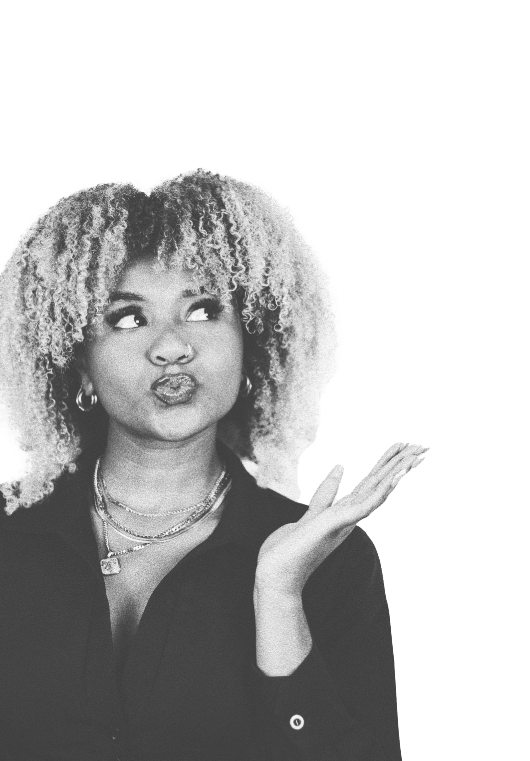 Young woman with curly hair looking up and to the side, with her hand raised.