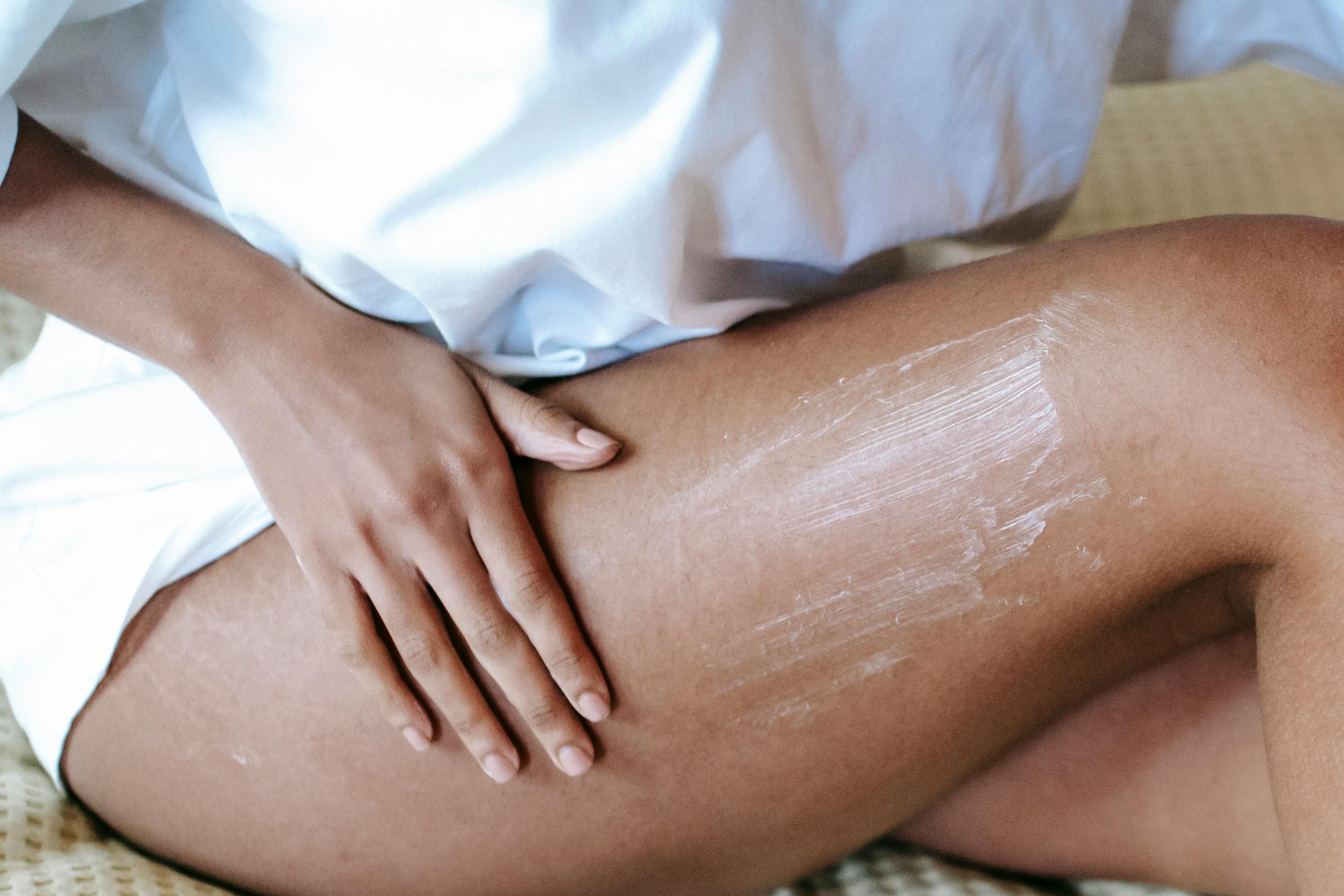 Person massaging knee for joint health and mobility