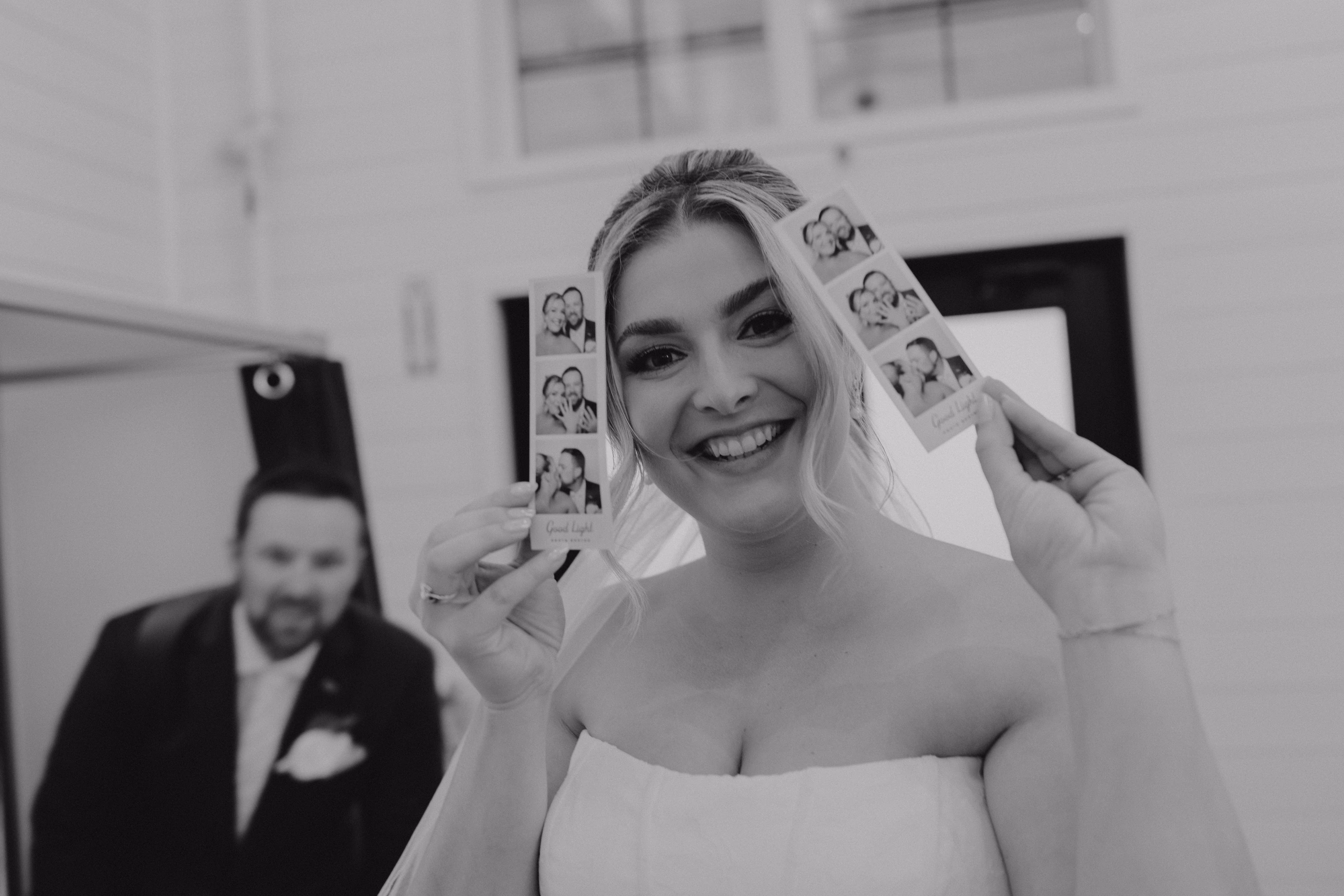 Wedding guests using the photo booth